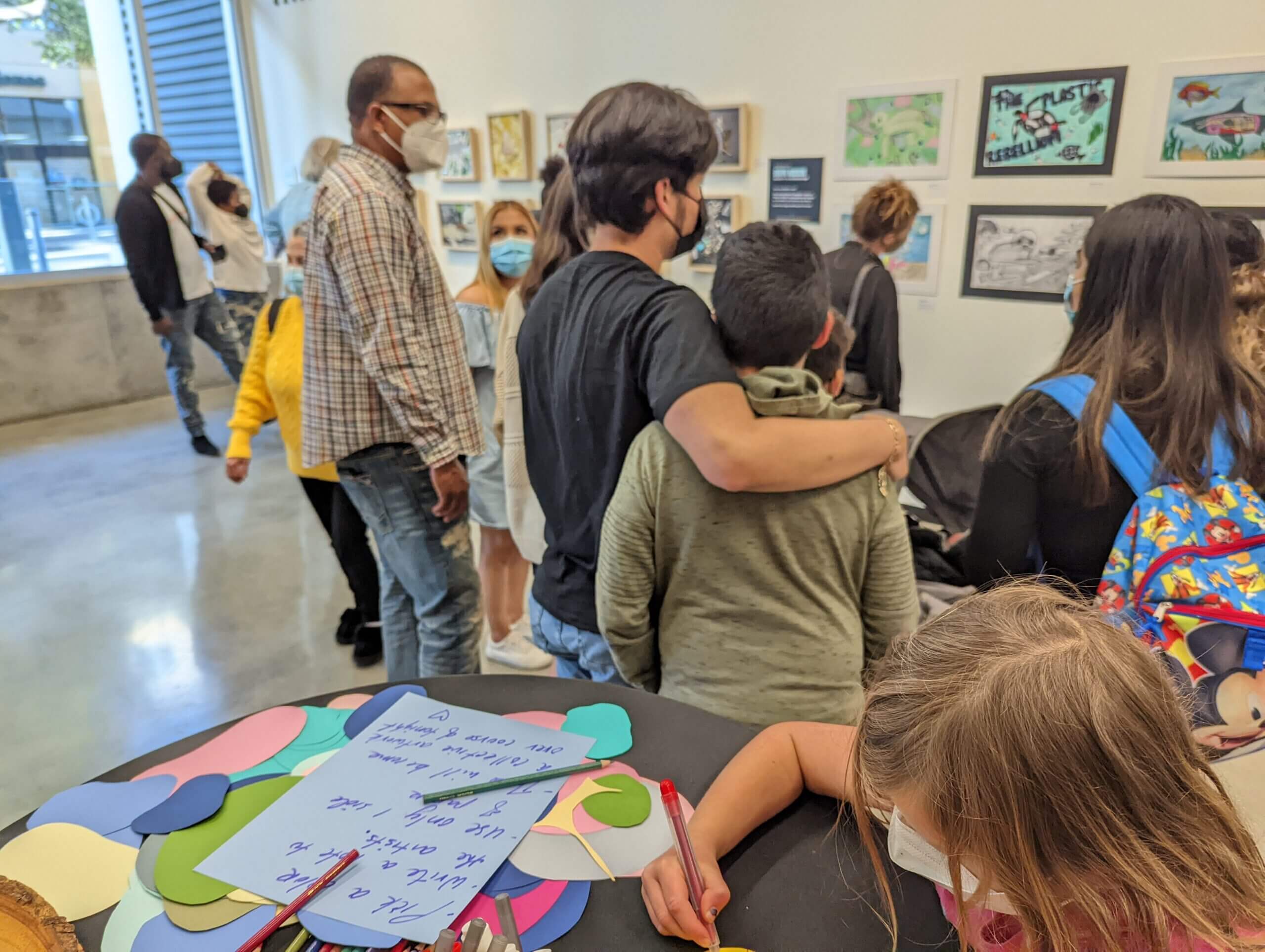 Group of gallery goers checking out the exhibition